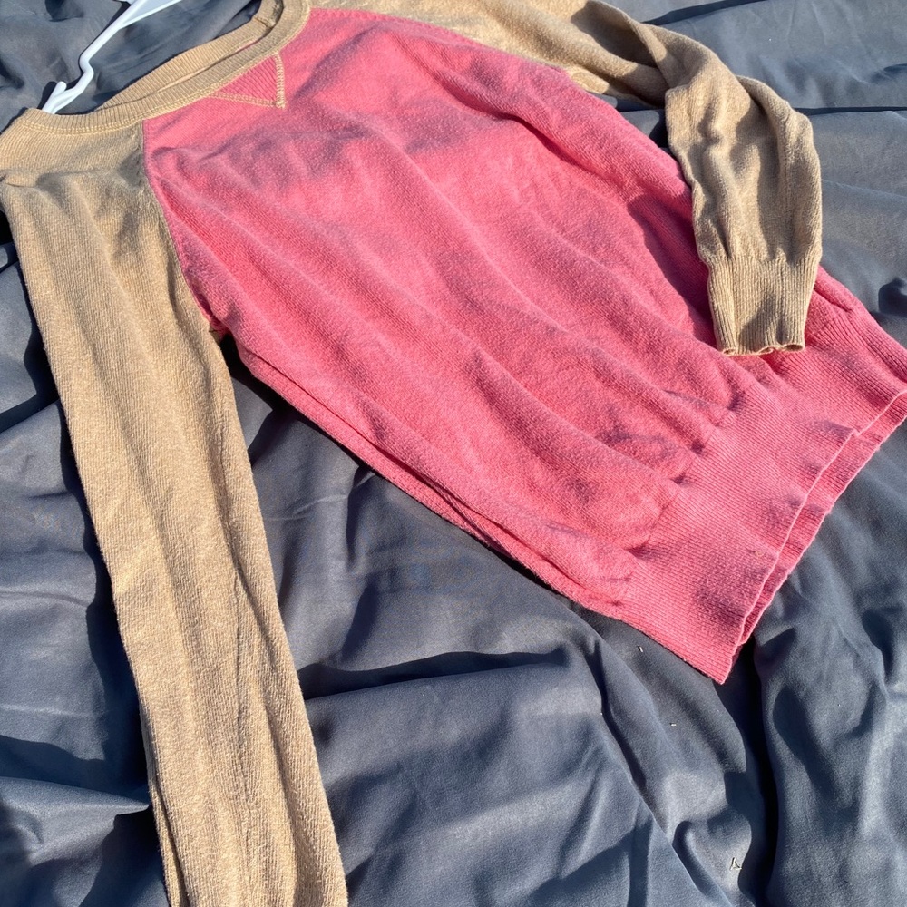 pink and beige long sleeve top